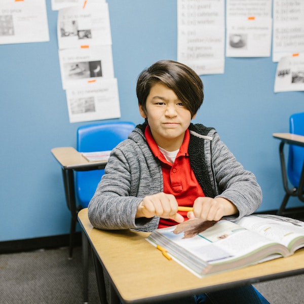 kid breaking a pencil