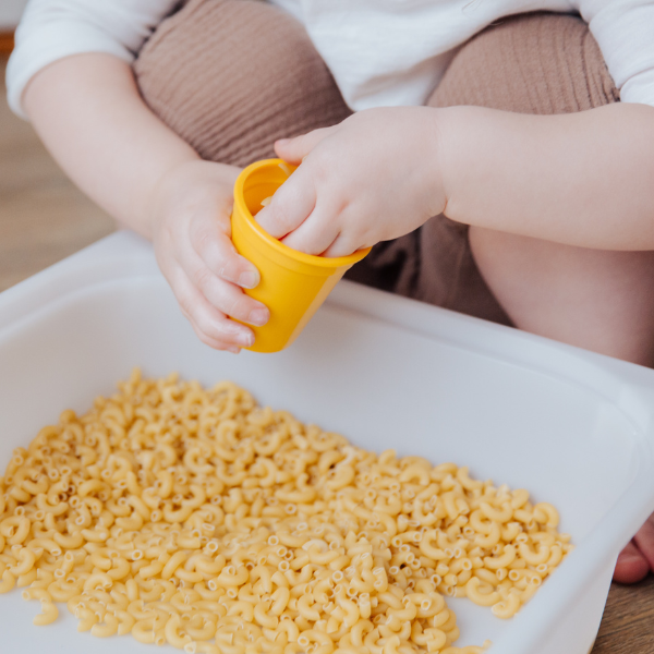 sensory table with pasta